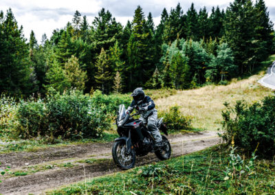 Honda XL750 Transalp riding on mountain trail