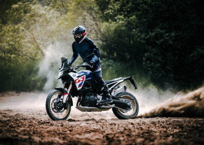 Dynamic action shot of the BMW F 900 GS navigating challenging off-road conditions, demonstrating its agility and power