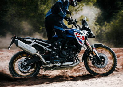 Dynamic action shot of the BMW F 900 GS navigating challenging off-road conditions, demonstrating its agility and power