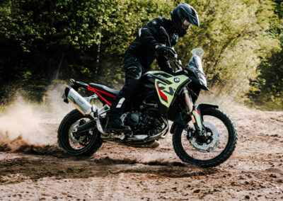 Dynamic action shot of the BMW F 900 GS navigating challenging off-road conditions, demonstrating its agility and power