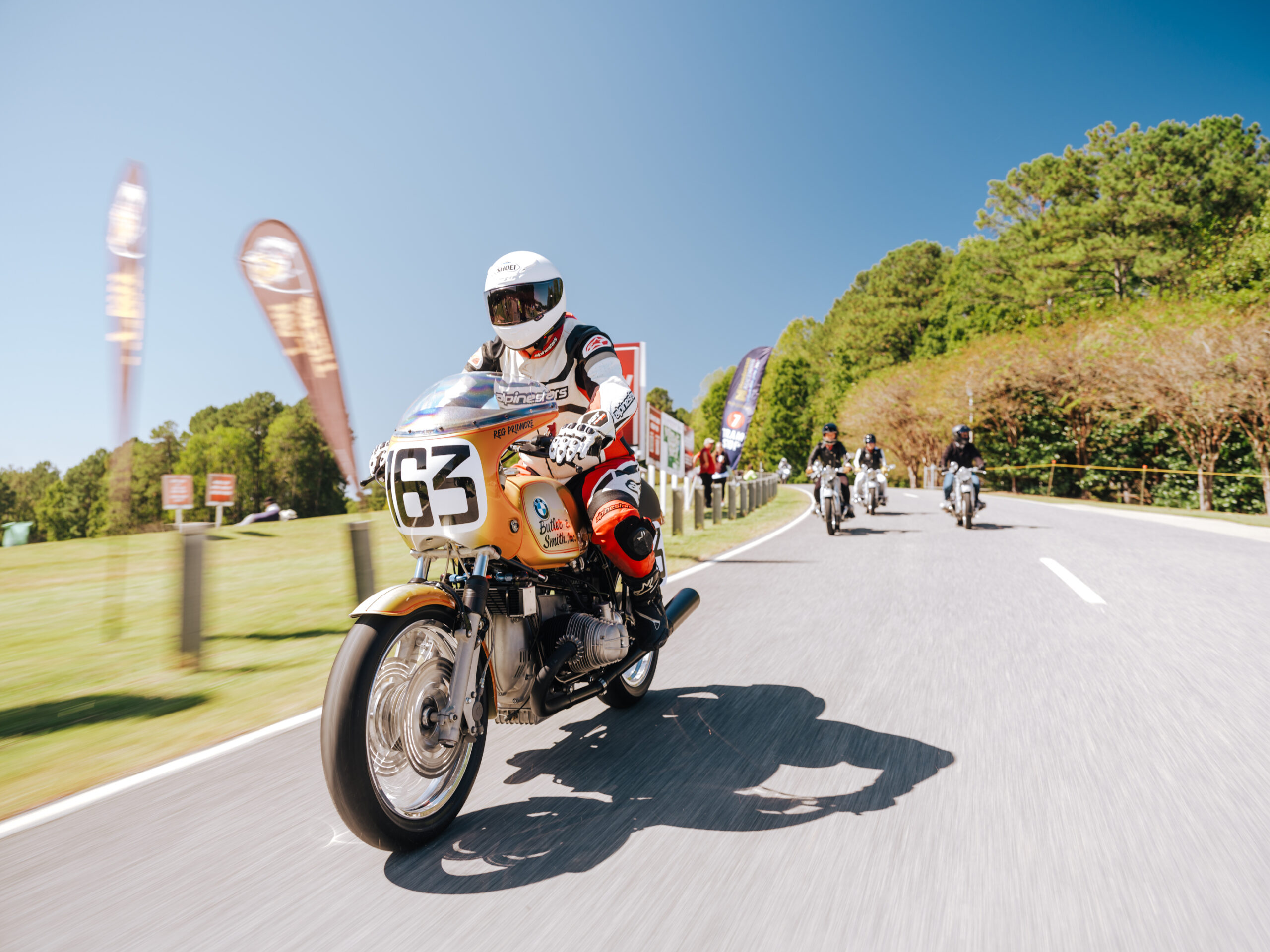 Vintage BMW motorcycles on display in the BMW Motorrad Fan Zone