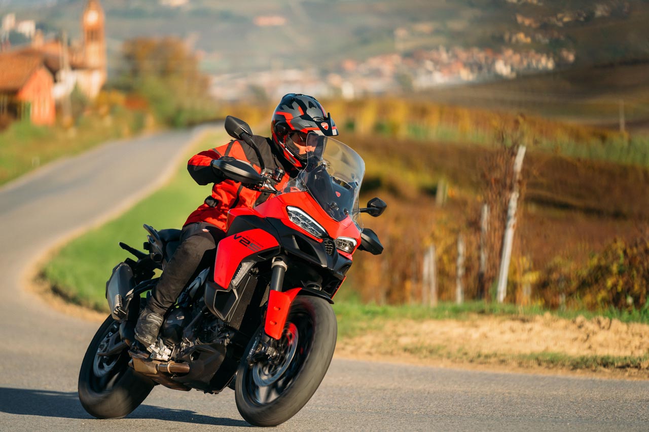 Front view of the Ducati Multistrada V2 S in Storm Green, highlighting its compact and aggressive styling