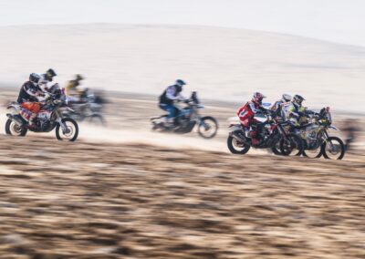 Motorcycles battle the relentless Empty Quarter sands in the Dakar 2025 adventure rally.