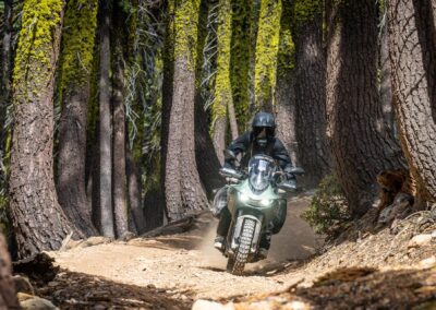 BMW R1250GS parked at a high-altitude fire lookout on an epic motorcycle travel route.