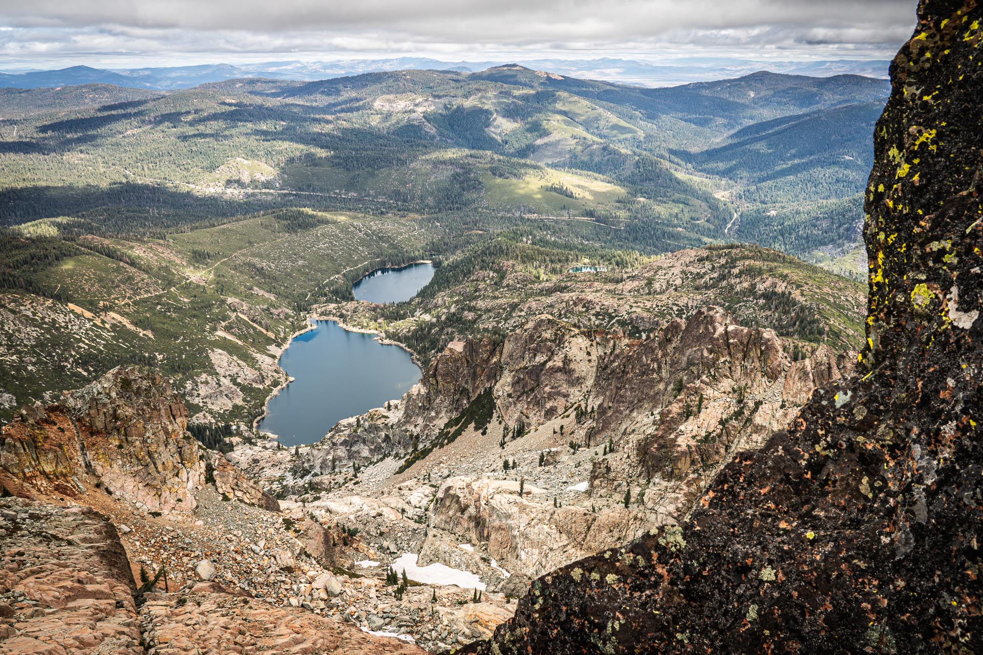 BMW R1250GS parked at a high-altitude fire lookout on an epic motorcycle travel route.