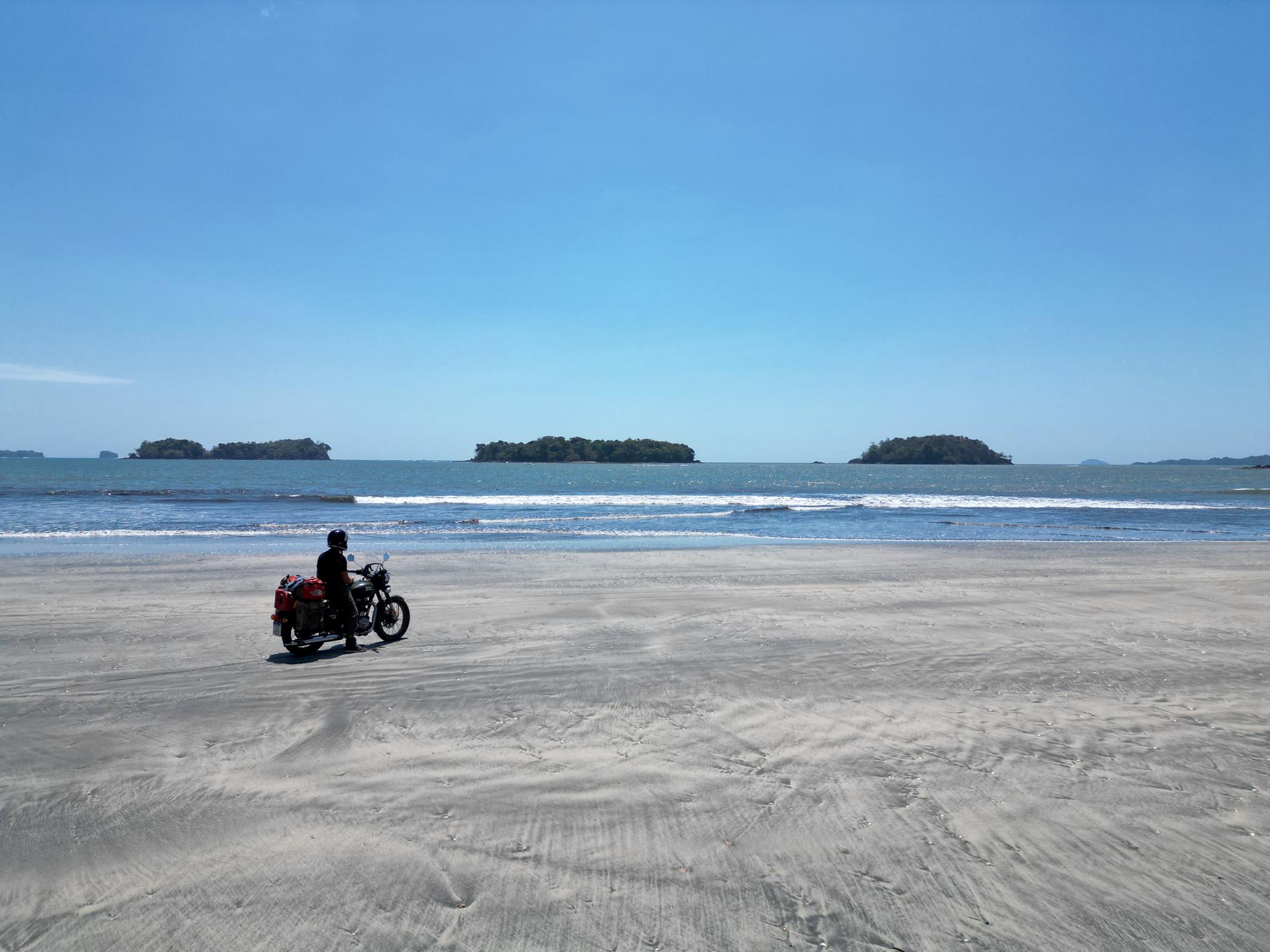 Motorcycle travel in Nicaragua: Diego Rosón riding through volcanic landscapes on his journey to Alaska.