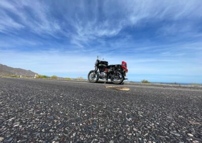 Motorcycle travel adventure: Diego Rosón and his Royal Enfield Classic 500 on a scenic road through Central America.